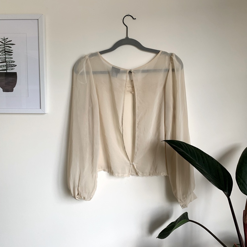 Rue 21 shirt. Lightly worn. Still great condition. Cream colored sheer top